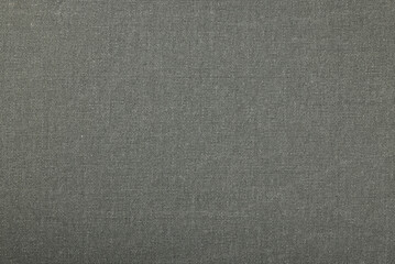Gray textile fabric surface showing woven texture close up