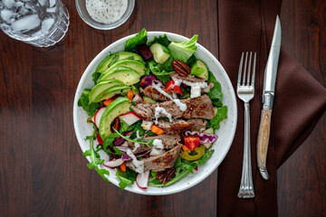 Top down view of a delicious steak salad, ready for eating.