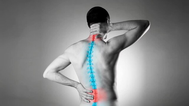 Lumbar and cervical spine hernia, man with back pain on a gray background, compression injury of the intervertebral disc