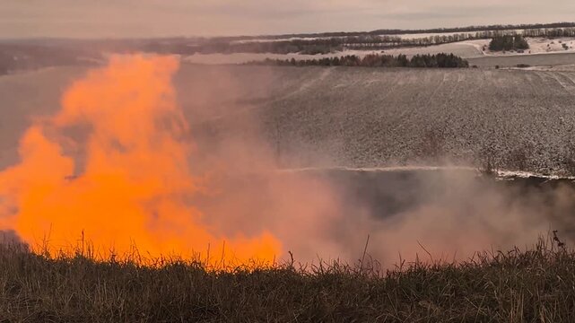 Ukraine, Shebelinka gas field engineers release and ignite problematic gas and gas condensate in a special barn for safety during a snowfall in winter