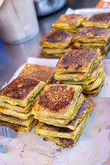Martabak telor at street food kitchen in Malaysia. Martabak is a popular street food in Malaysia and Indonesia