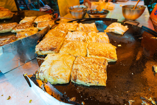 Martabak telor at street food kitchen in Malaysia. Martabak is a popular street food in Malaysia and Indonesia
