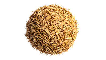A spherical cluster of dried, tan-colored grass blades against a stark black backdrop, illuminated by soft lighting