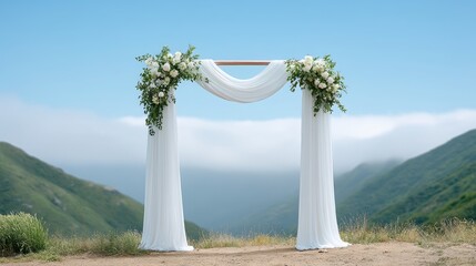 Fototapeta premium Beautiful floral arch set against a serene landscape with rolling hills and misty sky.