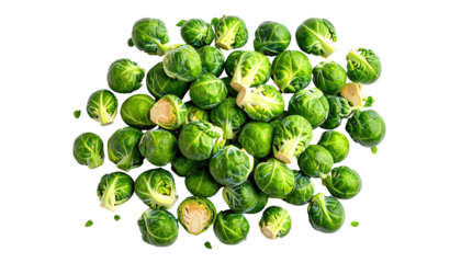 Piled green brussels sprouts against black background, some cut in half, showing layers of leaves