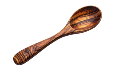 A wooden spoon with a distinct striped pattern against a stark black background is in sharp focus