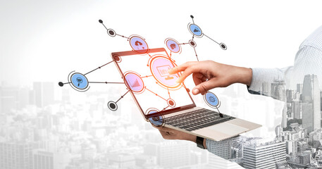 This image captures the essence of digital shopping, featuring a hand interacting with a laptop displaying virtual shopping icons, representing modern e-commerce trends. Tessel