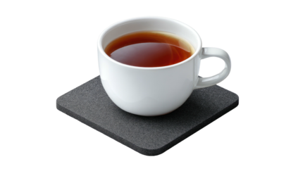 Dark liquid fills a white ceramic mug placed on a square gray coaster,isolated on a black background