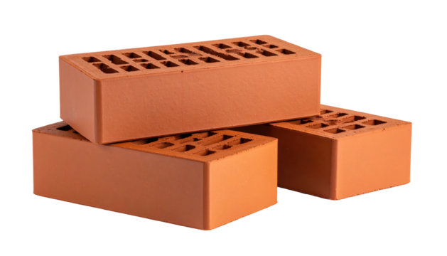 Three stacked red clay bricks on black background, illuminated and showing aeration holes throughout the structures