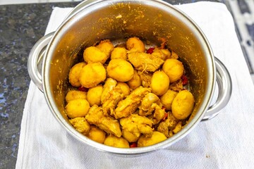 Traditional Brazilian dish of rice, chicken, and pequi (Brazilian caryocar), known as Goiana chicken stew.