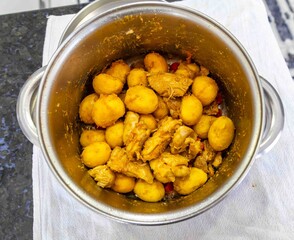 Traditional Brazilian dish of rice, chicken, and pequi (Brazilian caryocar), known as Goiana chicken stew.