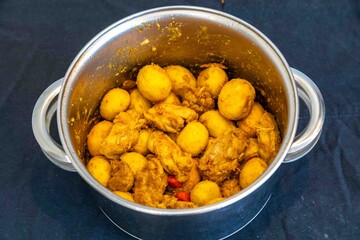 Traditional Brazilian dish of rice, chicken, and pequi (Brazilian caryocar), known as Goiana chicken stew.
