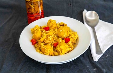 Traditional Brazilian dish of rice, chicken, and pequi (Brazilian caryocar), known as Goiana chicken stew.