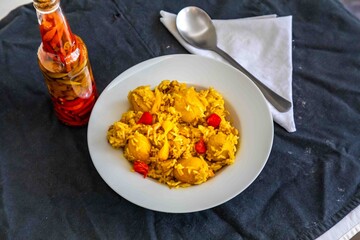 Traditional Brazilian dish of rice, chicken, and pequi (Brazilian caryocar), known as Goiana chicken stew.