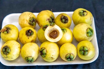 Yellow rose apple or white rose apple, Syzygium jambos. Native to Southeast Asia, this species belongs to the Myrtaceae family, a wild fruit with a rose petal flavor and aroma.
