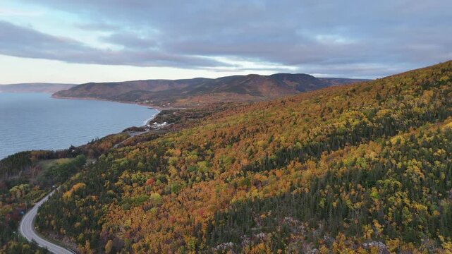 Spectacular Views of world famous Cabot Trail with beautiful views of the Atlantic Ocean coastline at the time of sunset, Cape Breton with Fall Foliage. MacKenzie Mountain, Cape Breton, Nova Scotia.