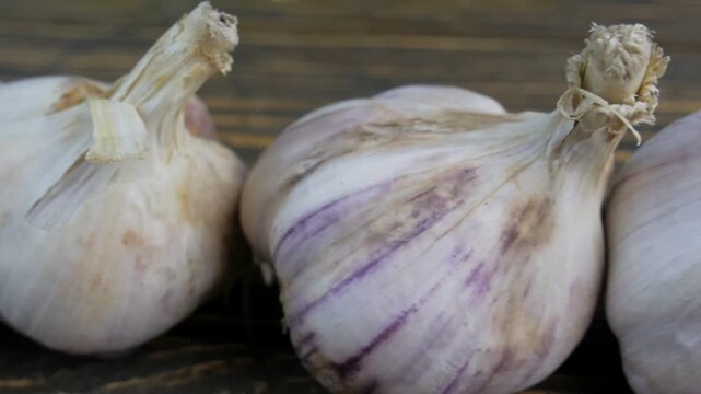 fresh garlic on a wooden background