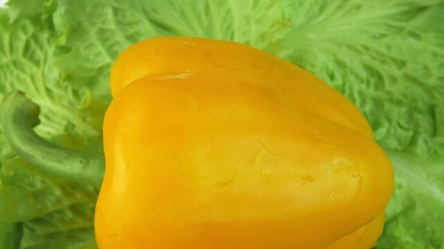 lettuce and sweet bell pepper on a rotating backgr