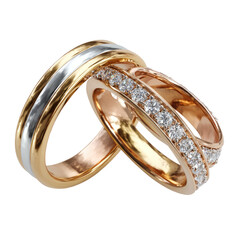 Two elegant wedding bands, one gold and silver, the other rose gold with diamonds, against a black background