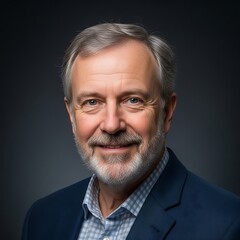 Portrait of a Smiling Mature Man with Gray Hair and Beard.