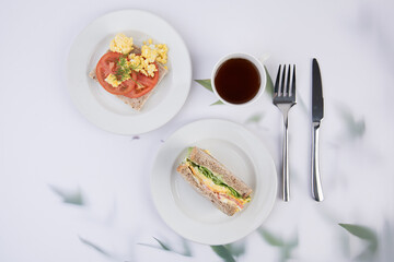 Delicious Breakfast and Lunch Spread with Sandwiches and Scrambled Eggs
