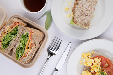 Delicious Breakfast and Lunch Spread with Sandwiches and Scrambled Eggs