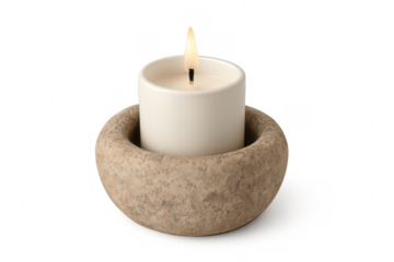 Burning white candle in stone holder spiritual light