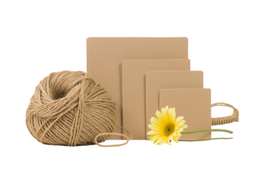 Natural twine and kraft paper cards with yellow flower against black background