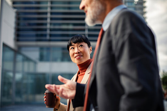 Business people talking outdoors