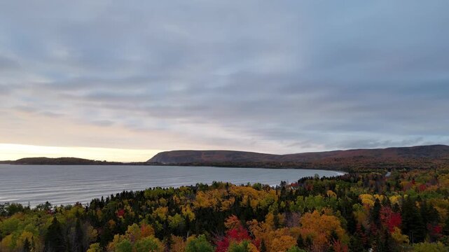 Ingonish Beach along Cabot Trail, Cape Breton, Nova Scotia, Canada. Incredible blue ocean waters with  the autumn fall foliage colors. 