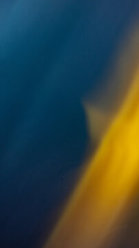 Cinematic Abstract Gradient: Deep Sapphire and Luminous Gold Light Leak