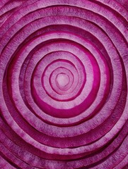 Fototapeta premium Close-up View of a Vibrant Red Onion Cut Into Circular Layers Showcasing Its Unique Textures and Colors