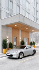 Silver Modern Electric Vehicle Parked Outside Contemporary Building Entrance in Snowy Weather with Yellow Planters and Warm Outdoor Lighting