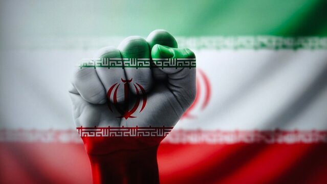 Fist raised with iran flag painted on hand, symbolizing resistance and power