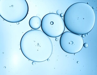 Closeup of translucent blue spheres floating against a light blue background