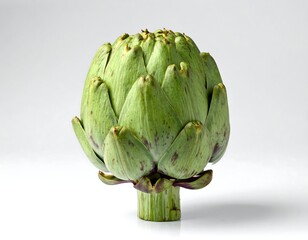 Obraz premium Close-up of a fresh, vibrant green artichoke on a white background