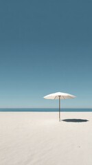 Tranquil Beach Scene with a White Umbrella on Sandy Shoreline