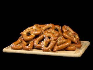 Stack of Soft Pretzels on Wooden Tray