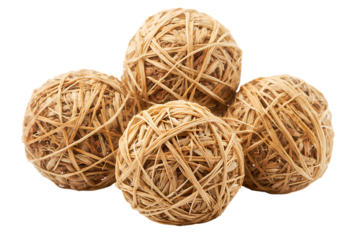 Four natural rubber bands formed into balls on a black background
