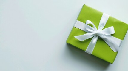 Vibrantly Wrapped Green Gift Box with White Ribbon for Special Occasions and Celebrations
