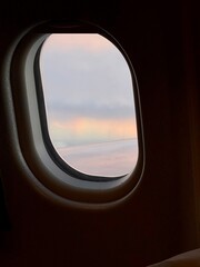 Naklejka premium Rainbow clouds from airplane