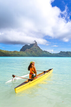 Local woman on outrigger canoe, Bora Bora, French Polynesia