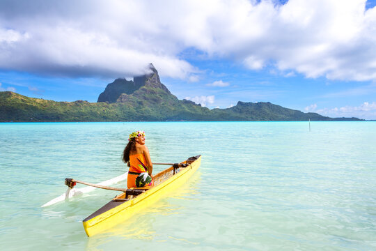 Local woman on outrigger canoe, Bora Bora, French Polynesia