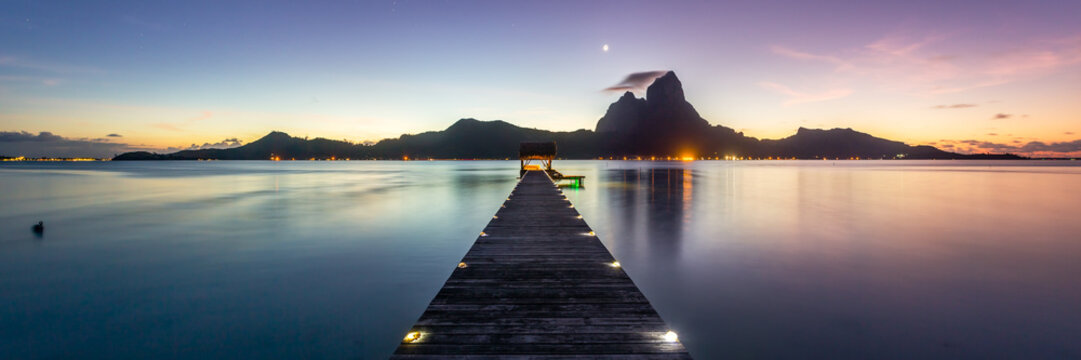 Panoramic of jetty at dusk,  Bora Bora, French Polynesia