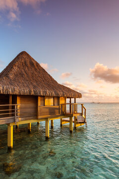 Overwater bungalow at sunset, Rangiroa, French Polynesia