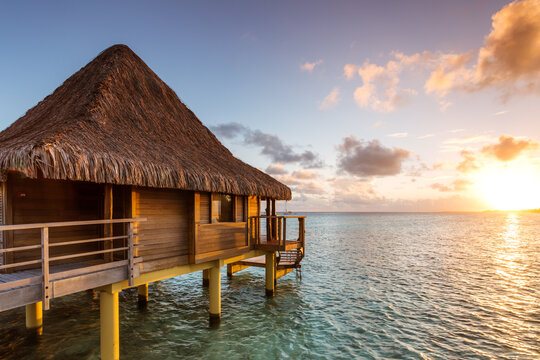 Overwater bungalow at sunset, Rangiroa, French Polynesia