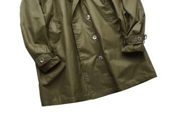 Naklejka premium Close up of a vintage olive green trench coat with buttons against a black background