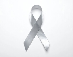 A shiny, silver ribbon symbol against a plain white background