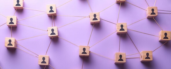 Wooden blocks with human icons connected by strings on a purple background representing a network or social connections