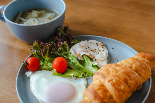 Healthy breakfast with croissant and salad
 - Powered by Adobe